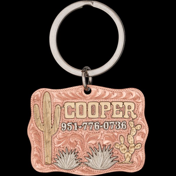 The Cooper Custom Dog Tag! Crafted with a copper base, featuring intricate jeweler's bronze cactus and paired with German silver bushes. Elevate your pet's style today!